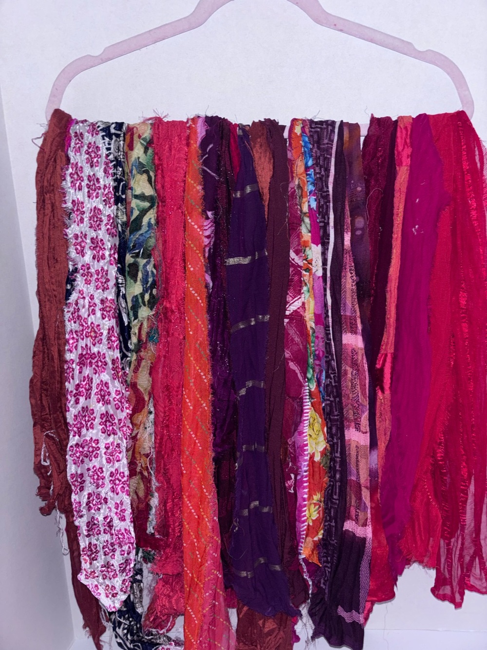 Vibrant sari silk fabric strip Collection in red and burgundy hues.